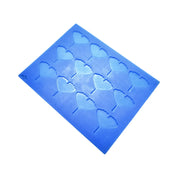 Blue silicone baking mat with fan-shaped ginkgo leaf tuile molds.