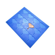 Blue silicone ginkgo leaf tuile mold with a golden leaf-shaped pastry decoration.