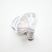 Three white plastic ginkgo leaf cookie cutters in graduated sizes stacked on a white background.