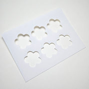 White plastic pastry stencil with six five-petal strawberry flower cutouts.