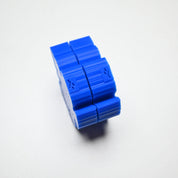 Two-piece blue silicone fig leaf veiner mold with a ridged, interlocking design.