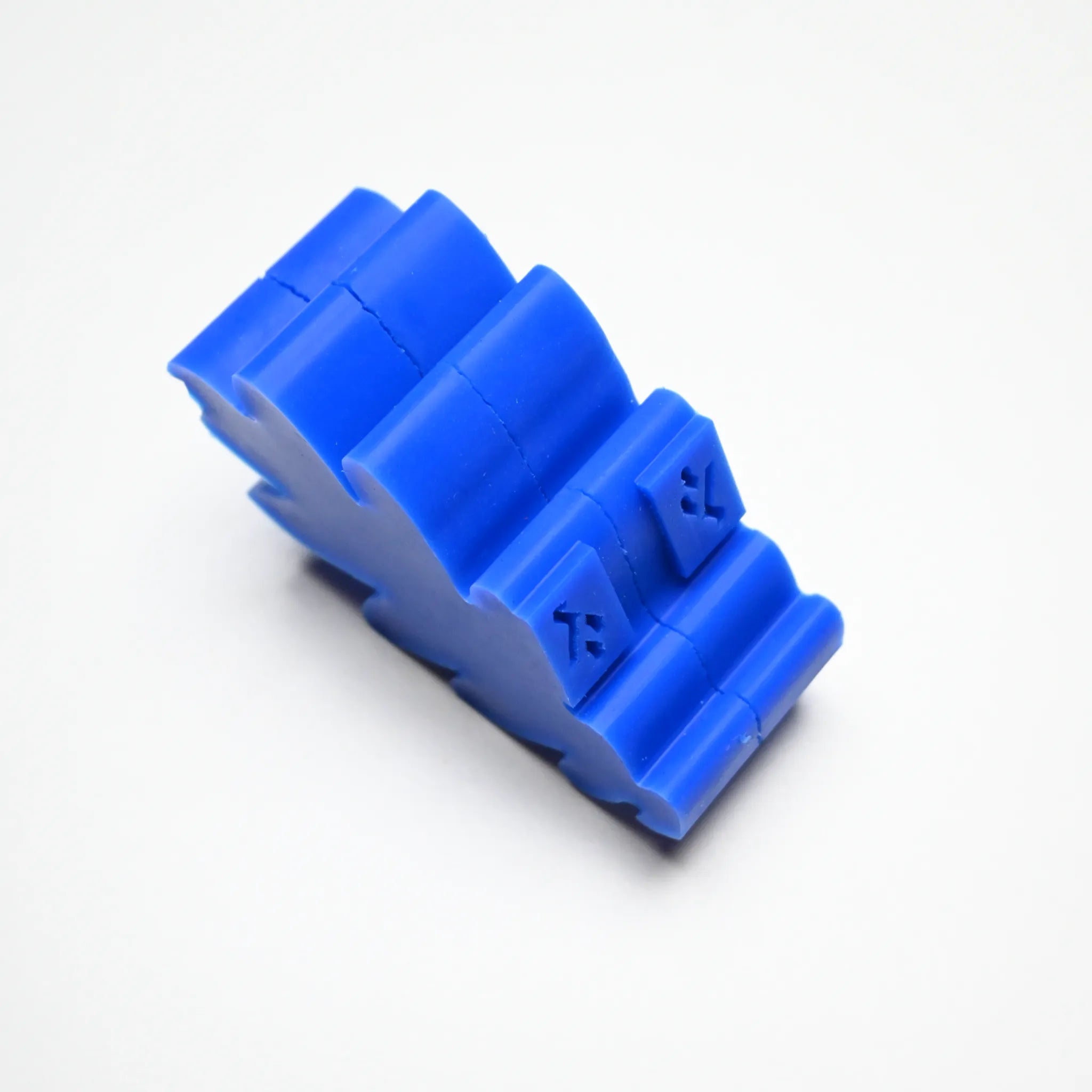Blue silicone oak leaf press mold with a thick, lobed leaf shape and textured details on a white background.