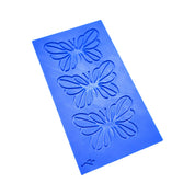 Blue silicone tuile mat featuring three detailed butterfly-shaped molds.