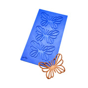 Blue silicone PAPIRYS tuile mat with three butterfly-shaped molds and a finished bronze butterfly tuile.