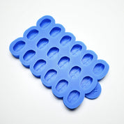 Blue silicone mold with multiple coffee bean-shaped cavities on a white background.