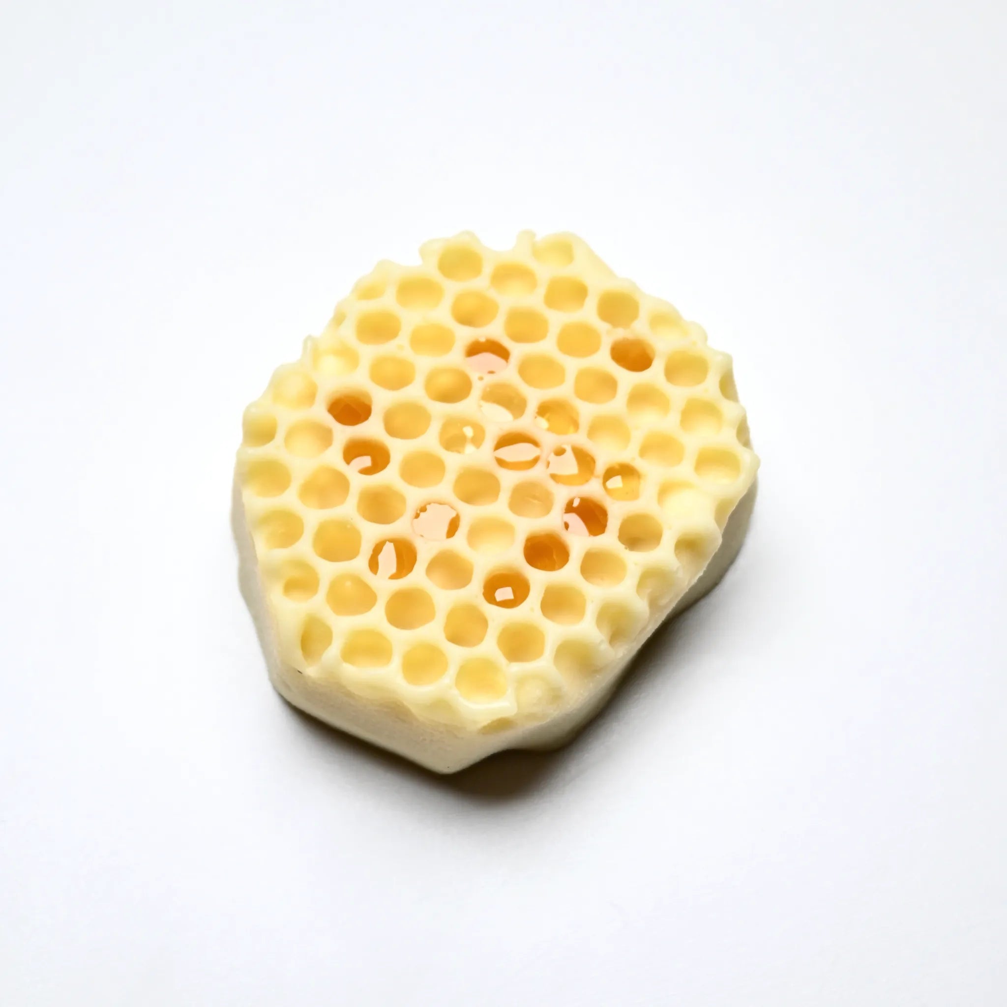 Yellow honeycomb fragment silicone mold with realistic irregular cell shapes.