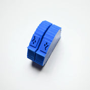 Blue silicone birch leaf press mold with a curved, ridged semi-circular design.
