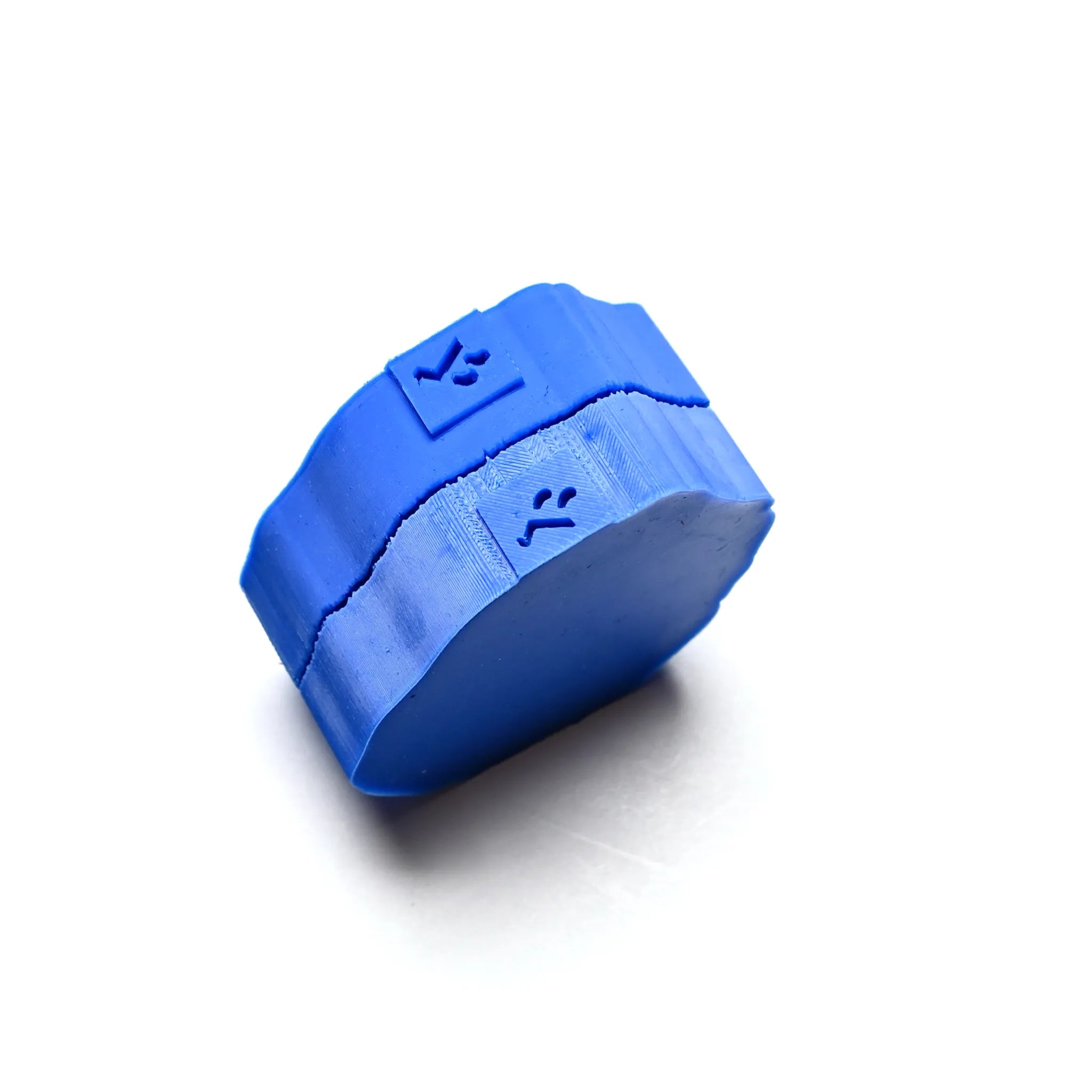 Blue silicone nasturtium leaf press mold with a round, textured design.