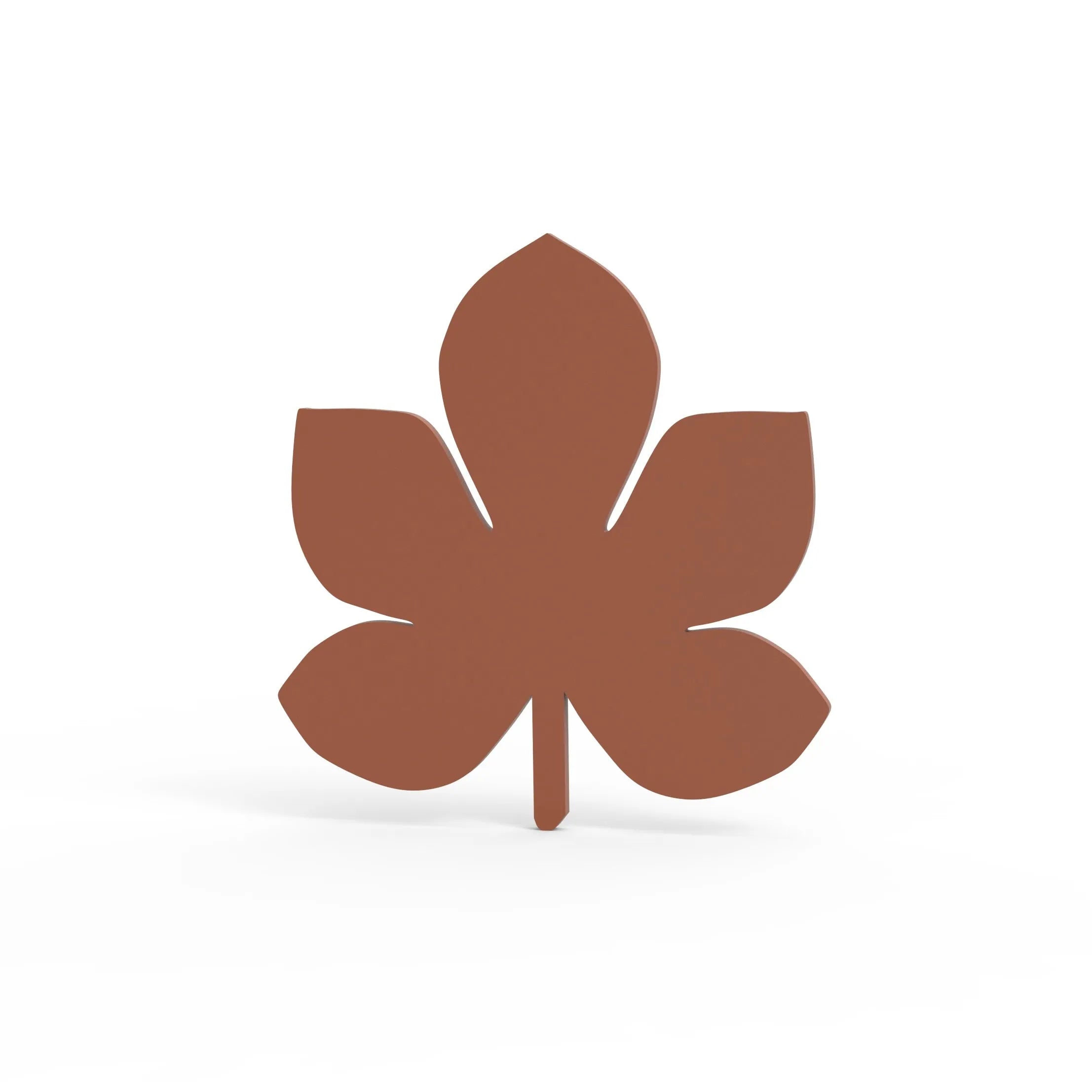 Brown horse chestnut leaf shaped silicone tuile mold on a white background.
