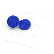 Blue silicone fan press molds with ribbed circular designs on a white template.