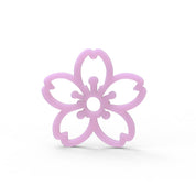 Pink sakura cherry blossom shaped silicone tuile mold on a white background.