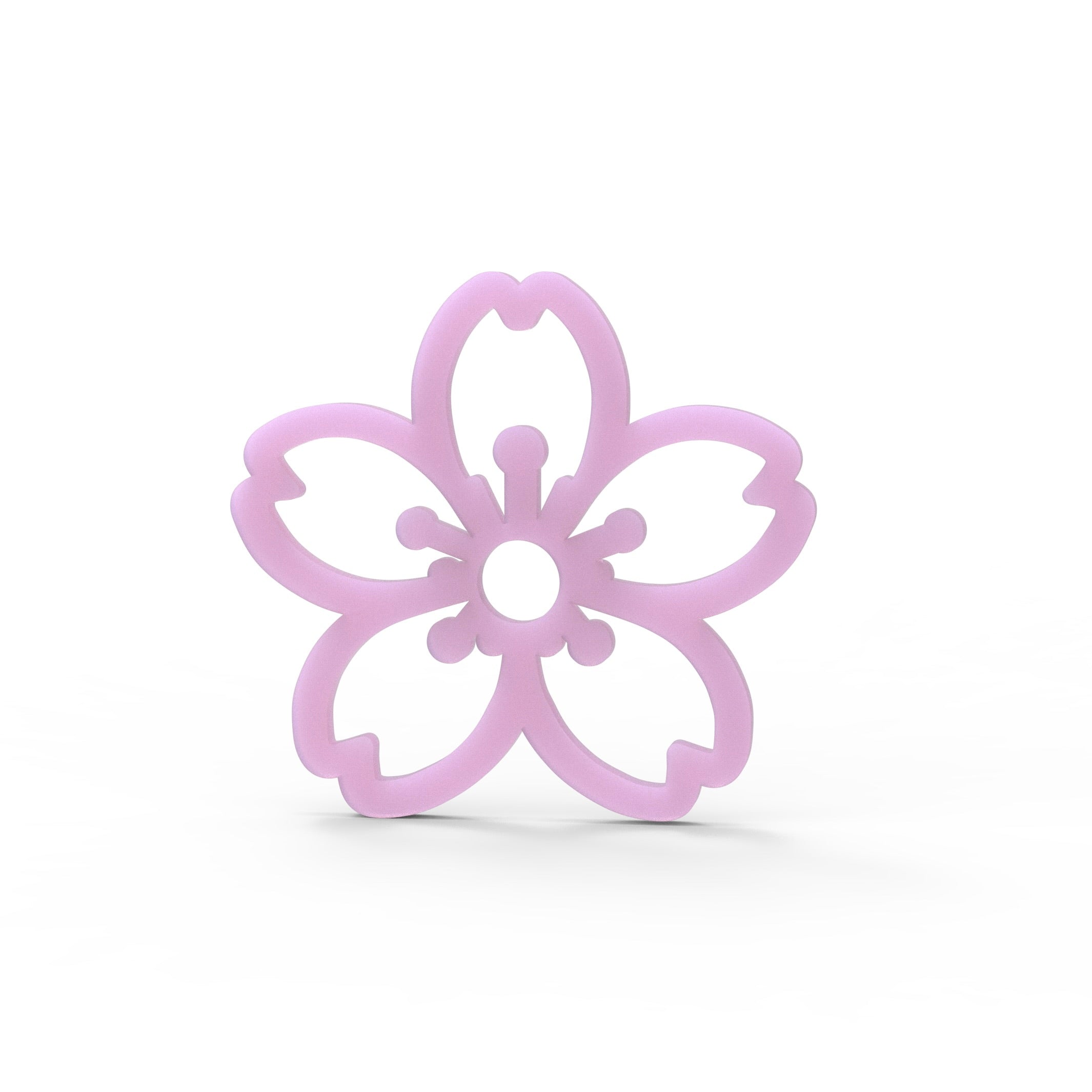 Pink sakura cherry blossom shaped silicone tuile mold on a white background.