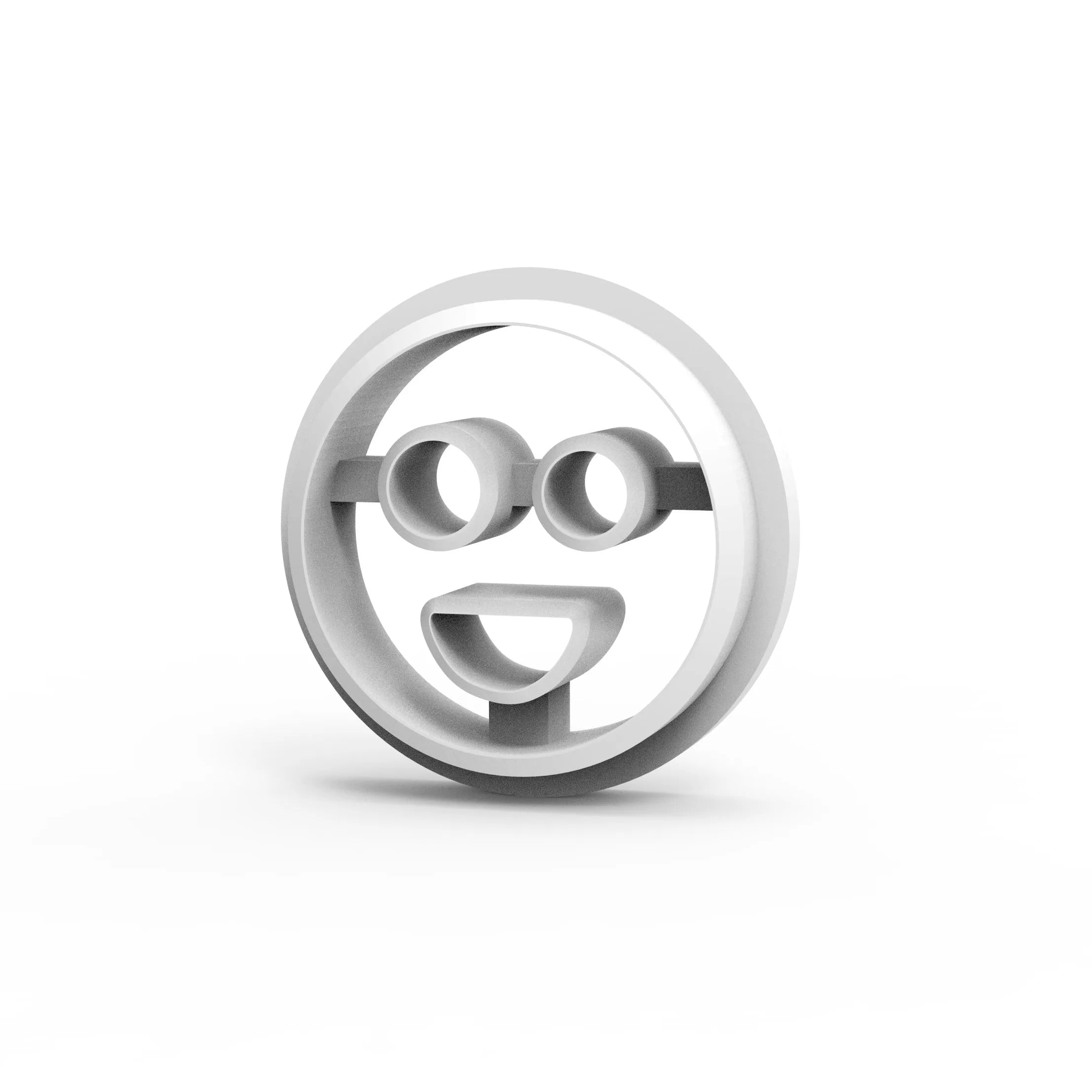 White round smiley face cookie cutter with glasses and a happy open mouth shape.