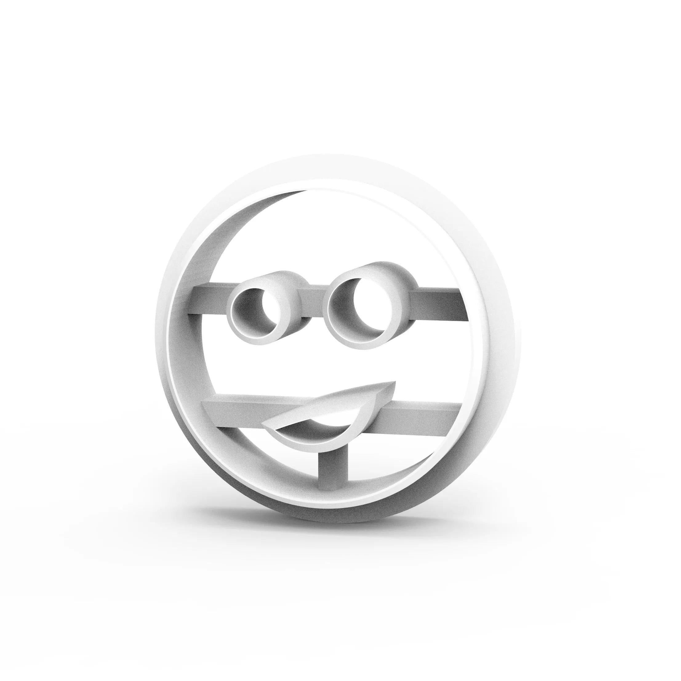 White round smiley face cookie cutter with circular eyes and a smirk mouth shape.