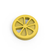 Yellow silicone mold in the shape of a round lemon slice with segmented cutouts.