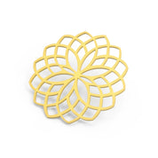 Yellow rosette silicone tuile mat with an intricate, geometric floral pattern.