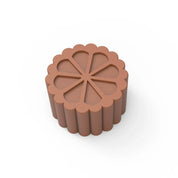 Brown silicone fluted flower mold with a scalloped edge and eight-petal design.