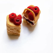 Woven basket-shaped pastry filled with raspberries, made using a silicone basket mold.